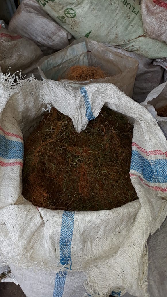 Image 26. Open woven sack filled with coconut coir and fibrous plant material